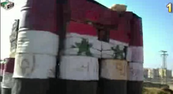 الصورة حاجز عسكري جنوبي حمص - يوتيوب