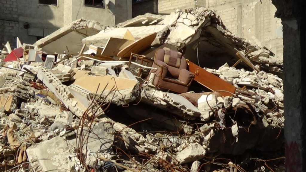 Destroyed buildings in the Seil neighbourhood. Local activists say that army forces destroyed these buildings in order to widen their field of vision. Photography by Razan Zeitouneh