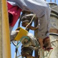 A technician from the General Committee for Civil Defence in Daraa fixes electricity lines – The General Committee’s Facebook Page