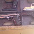 Pistols are displayed at a market in Qamshli. Photography by Vyan M