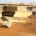 This farm chicken in village if Azzan outside Aleppo was used as a military post by pro-Assad militias and then captured by fighters from Ahrar al-Sham in November. Credit: YouTube.