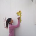 Amal, Um Jamal's daughter, decorates her mother's makeshift beauty salon in Zaatari Camp. Photography by Milia Eidamouni.