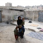 أمرأة تعيش مع أطفالها  في كهف في حي المعادي بحلب